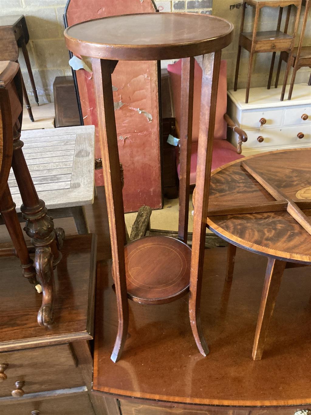 An oval marquetry inlaid mahogany occasional table, width 75cm, depth 52cm, height 50cm, together with an Edwardian two tier plant stan